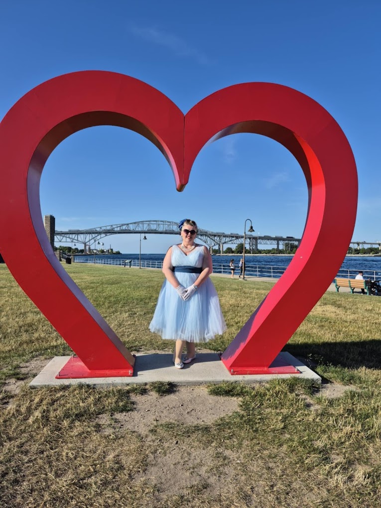 Customer wearing an altered vintage-style dress at an outdoor event